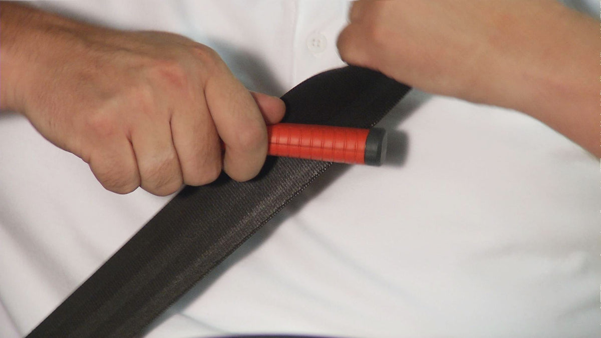 Lifehammer next to hand to show compact size and easy one-handed handling
