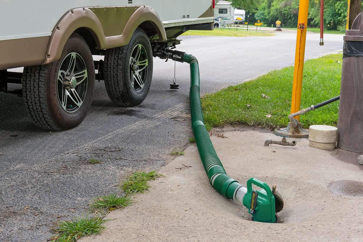 Lippert Components fully extended 20-foot hose reaching a campsite inlet easily