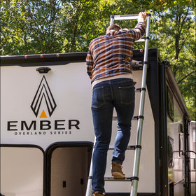 Lippert On-The-Go next to person showing scale and lightweight portability