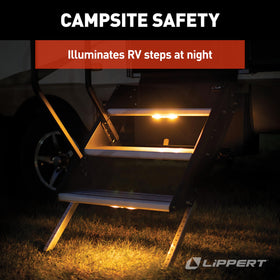 Lippert step light next to AA battery showing size and easy battery replacement