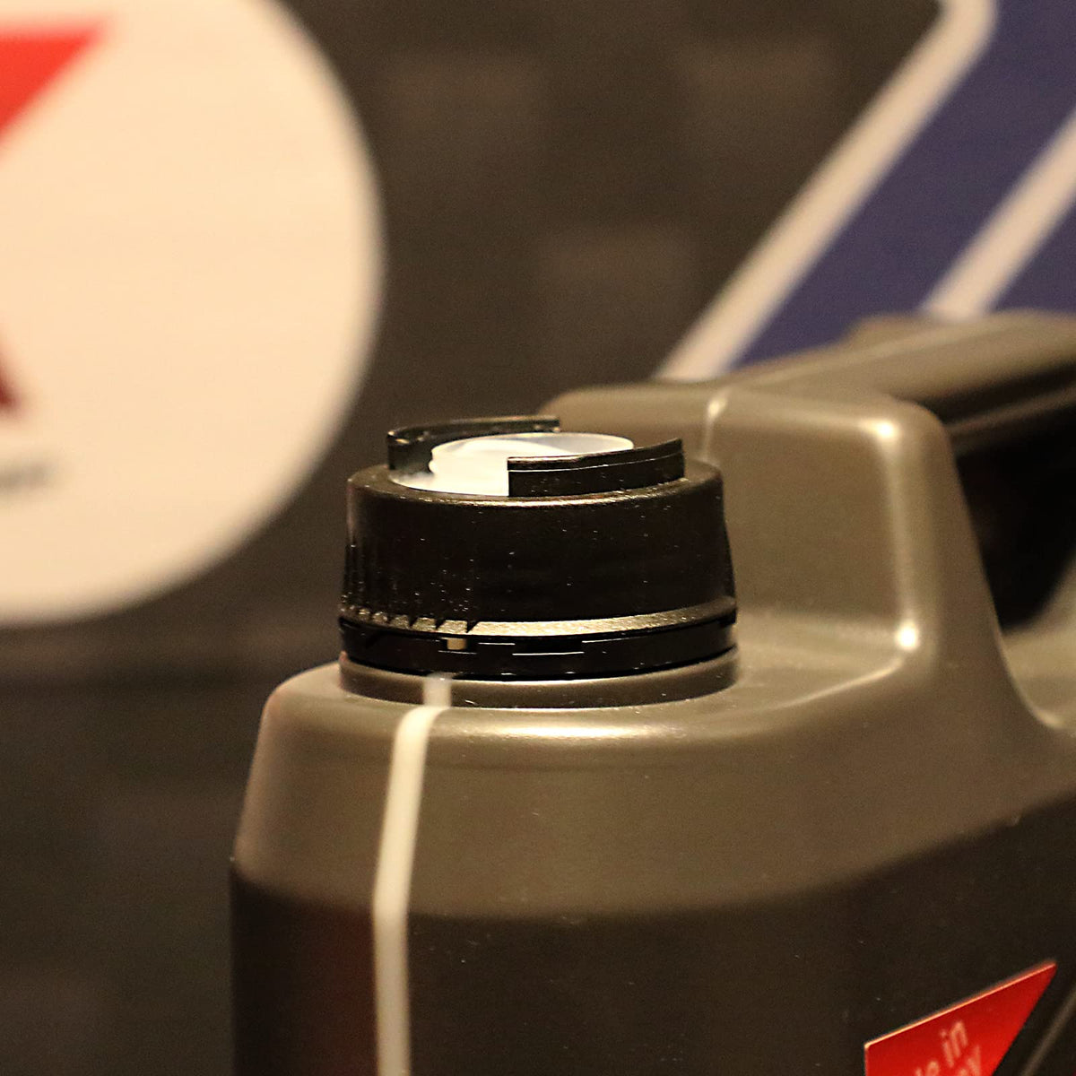 Liqui Moly pouring closeup demonstrating controlled pour and spill reduction