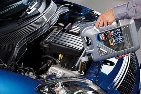 Liqui Moly TOP TEC 6610 being poured with 5L scale to demonstrate volume and easy filling
