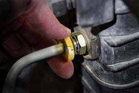 Lisle 22930 in use inside an engine bay enabling quick-release of connector