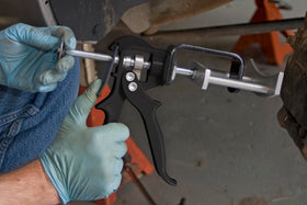 Lisle 25750 in use compressing dual caliper pistons to simplify pad replacement