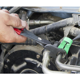 Lisle 37300 in use disconnecting a fuel line in a tight engine bay for easier service