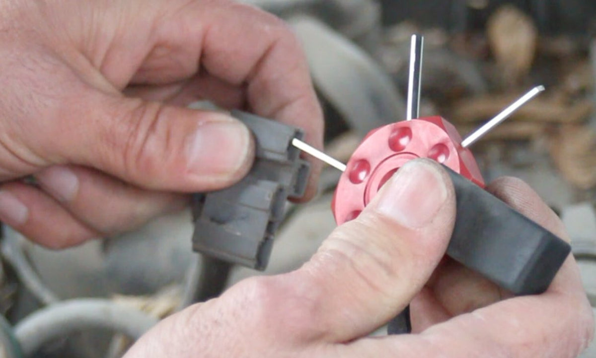 Lisle 57750 in use removing wire from connector showing safer, damage-free terminal extraction