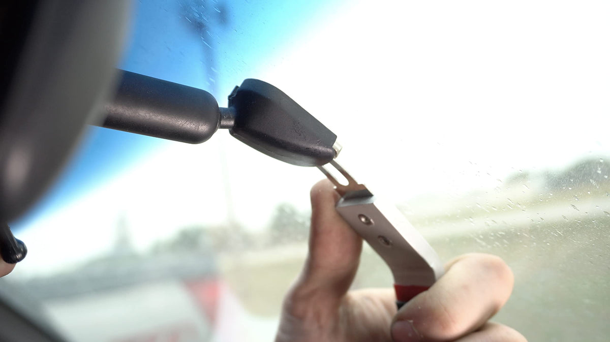 Lisle 83050 in use removing Ford rearview mirror demonstrating safe release