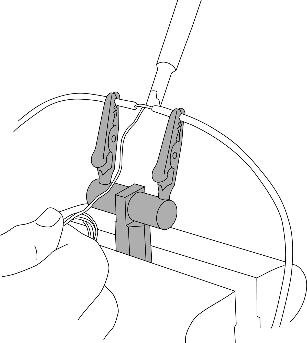 Lisle clamp in use on workbench holding wire for safer, hands-free soldering