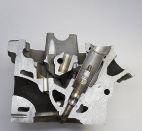 Lisle porcelain puller close-up gripping ceramic terminal to safely remove broken plug
