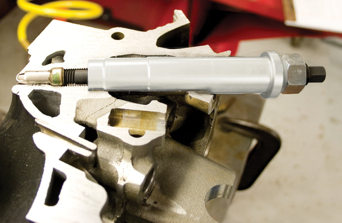 Lisle tool in use on Triton engine demonstrating clean plug tip extraction benefit
