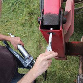 LockNLube coupler under pressure test showing 10,000 PSI durability benefit