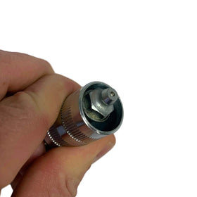LockNLube adapter attached in a cramped engine bay demonstrating improved reach