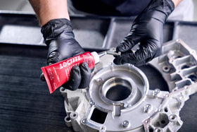 Loctite being applied to a head bolt showing correct coverage for reliable sealing
