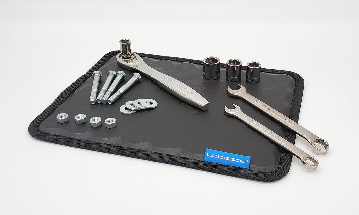 Lodesol pad placed on car fender holding bolts securely during repair
