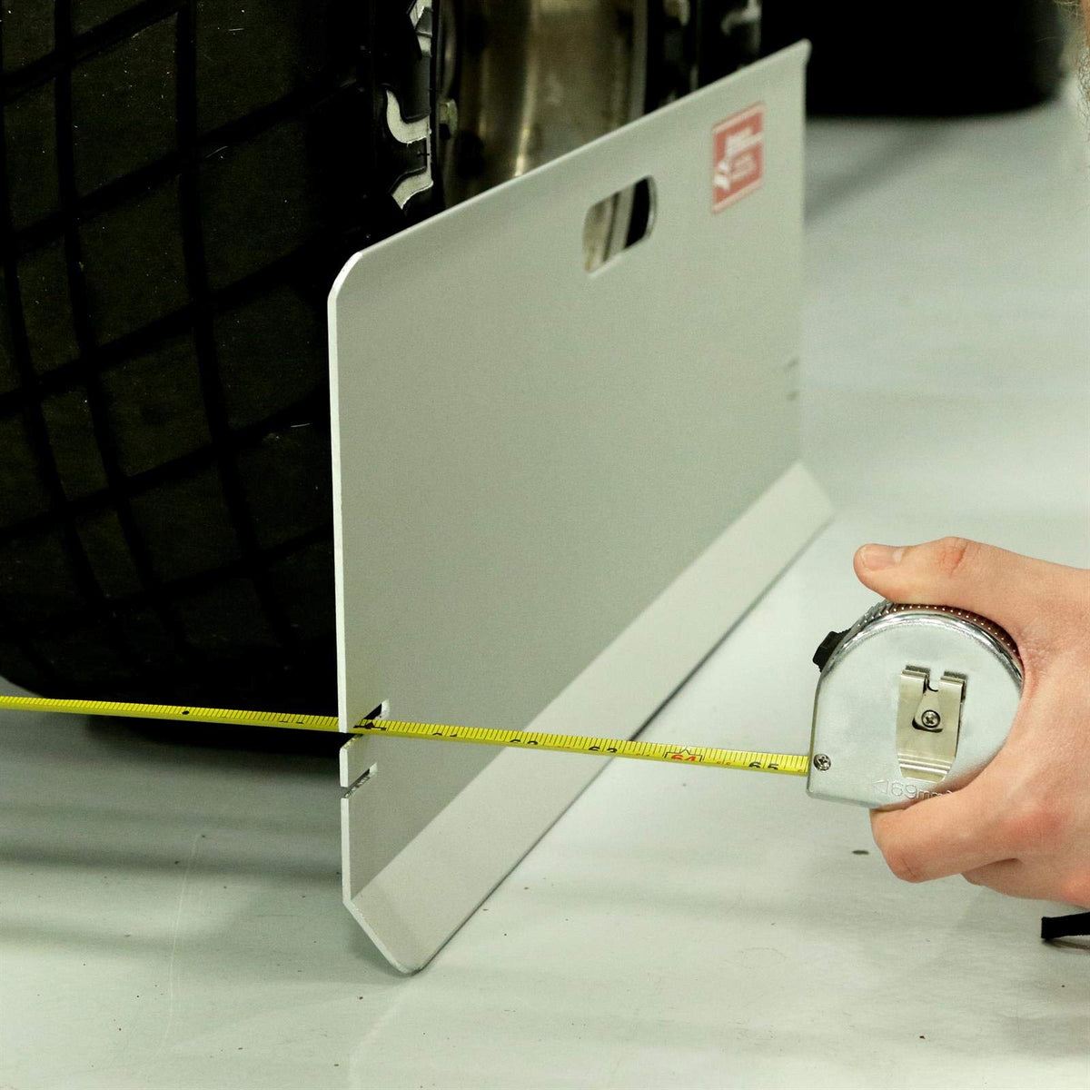 Longacre magnet detail holding tape steady to prevent slipping during reads