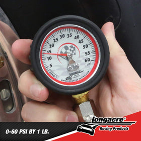 Longacre gauge held in hand for scale and portable garage convenience