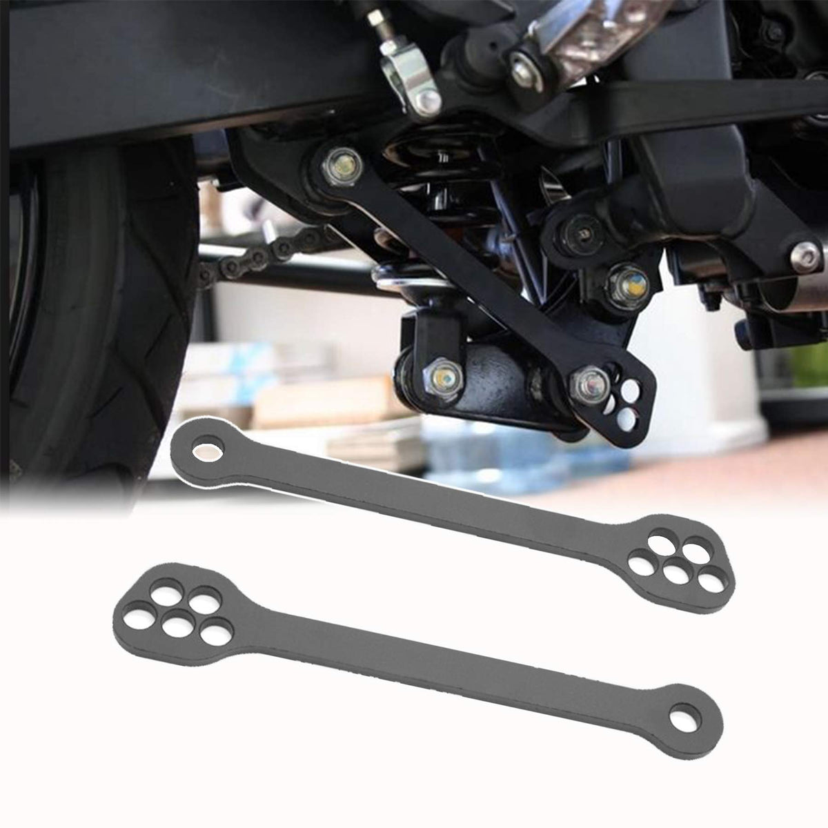 Kawasaki lowering links close-up of precision-machined holes and fit