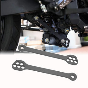 Kawasaki lowering links close-up of precision-machined holes and fit