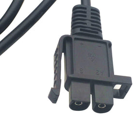 LS charger next to ruler showing compact size for convenience