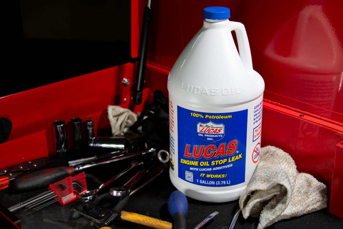 Lucas Oil 10279 in an engine bay while being added, showing easy application benefit
