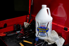 Lucas Oil booster in use on heavy equipment showing restored performance benefit