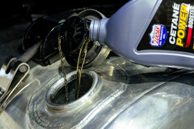 Lucas Oil cetane power booster close-up cap and measuring guide for accurate use