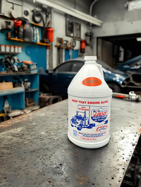 Lucas Oil being added to engine oil filler to improve startup lubrication