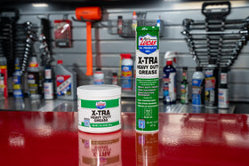 Lucas Oil grease cartridges beside ruler for scale, convenient 14.5 oz size