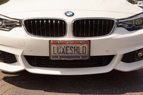 Luxe Shield in rain showing water runoff and reduced condensation on plate