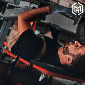 M-AUTO laid flat under a car enabling low underbody access and mobility
