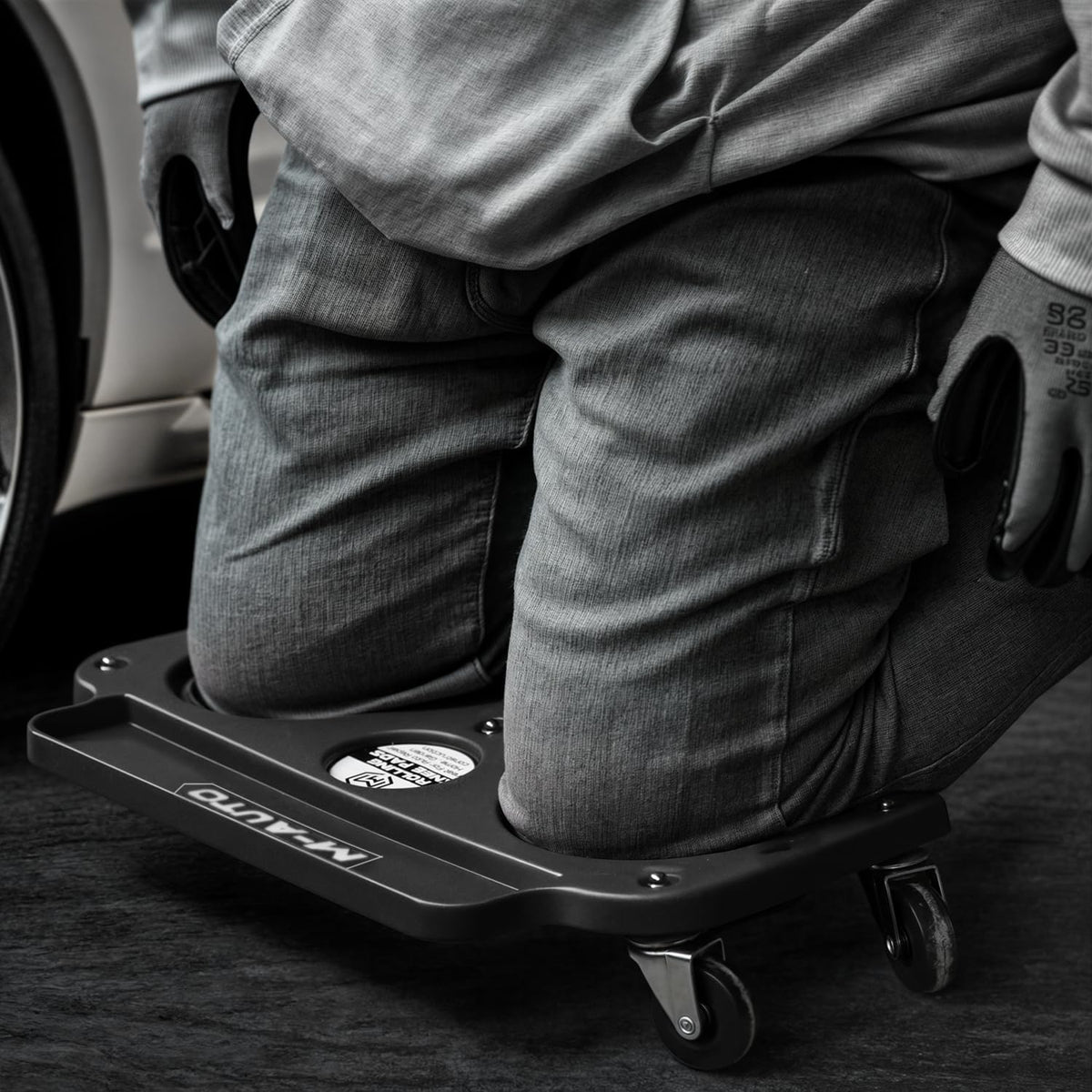 M-AUTO on concrete floor showing durable wheels and scratch-free rolling benefit