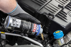 MAATSEN Liquii Moly pouring detail demonstrating easy addition to engine oil