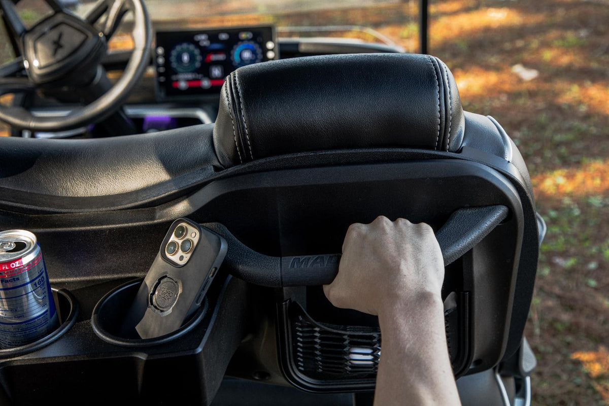 MADJAX handle in use on a golf cart providing passenger support and stability