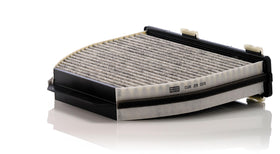 MANN-FILTER close-up of activated carbon layer capturing odors and gases