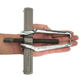 MANNIFEN puller next to ruler for scale, clarifies size and reach benefit