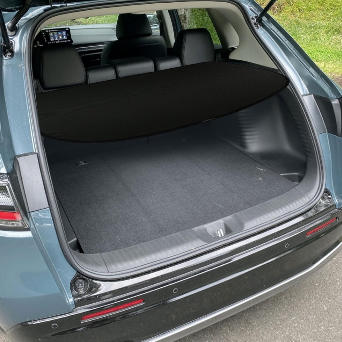Marretoo lifestyle shot with groceries hidden showing improved trunk tidiness