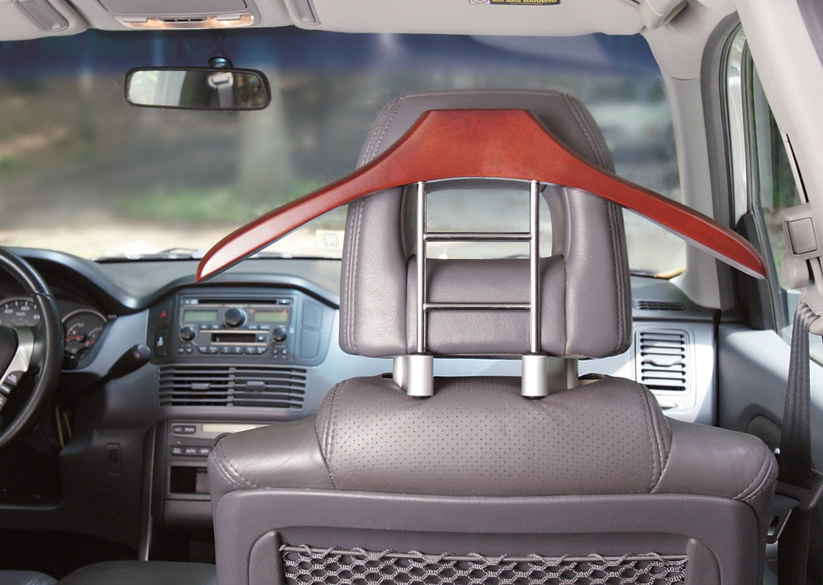 MAXSA installed on a car headrest displaying wrinkle-free jackets while driving