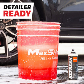 Maxshine bucket beside hands for scale showing 5-gallon capacity benefit