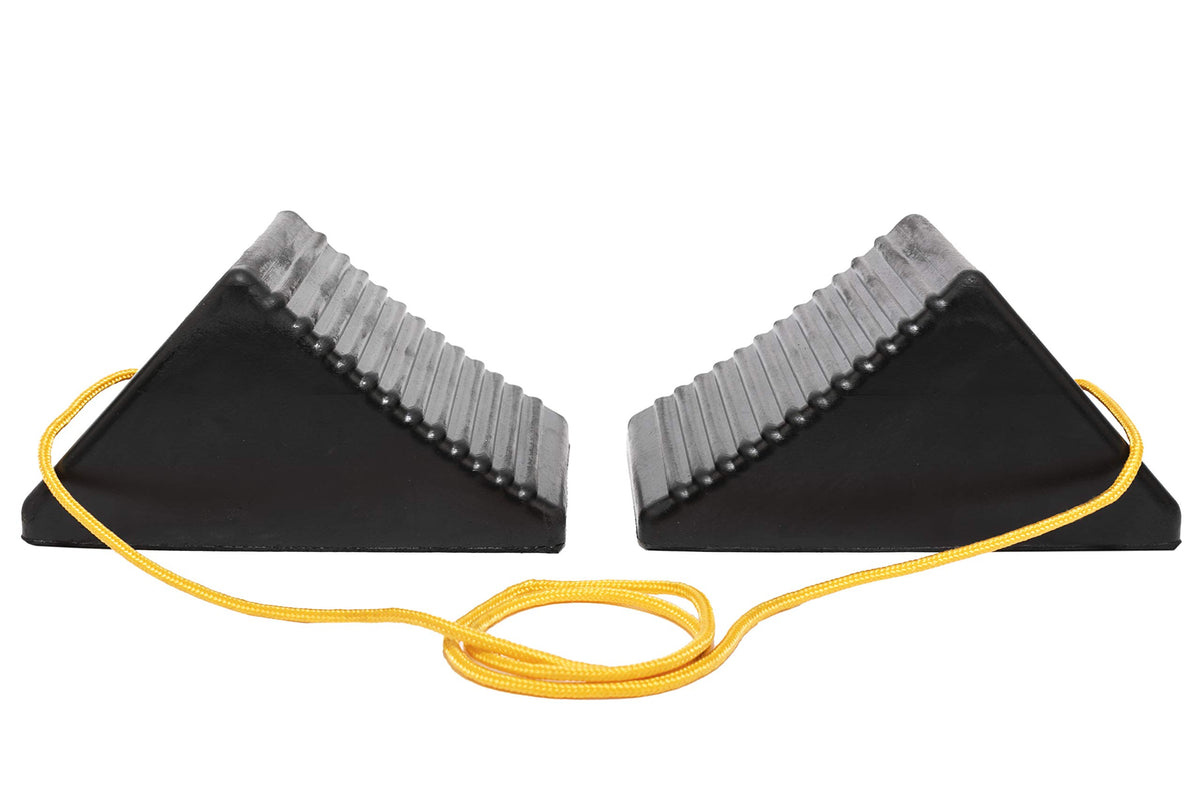 MAXXHAUL chock positioned against RV wheel demonstrating stability