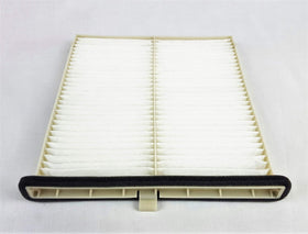Mazda cabin filter pleat close-up displaying media texture and dust capture benefit