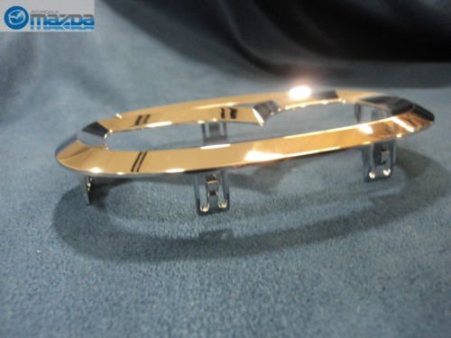 Mazda emblem installed on grille demonstrating factory-accurate alignment and appearance