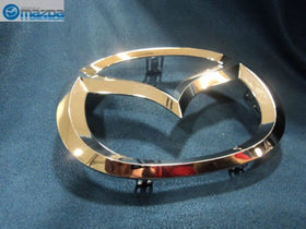 Mazda emblem packaging and part number C235-51-731A confirming authentic replacement