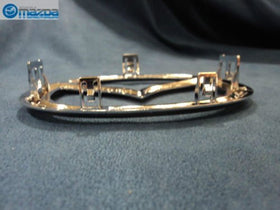 Mazda emblem size scale with ruler indicating correct OEM dimensions and fit