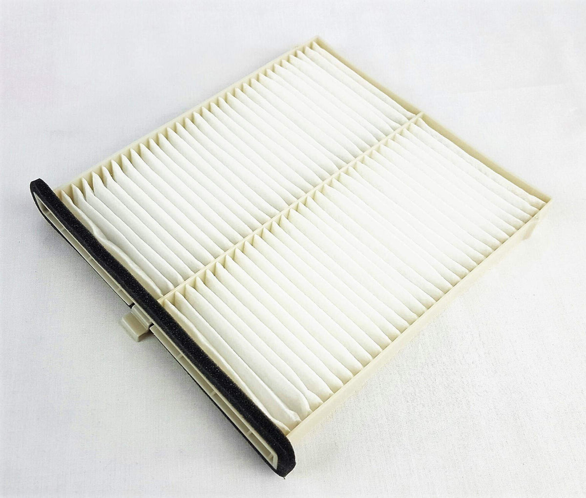 Mazda cabin filter installed in glovebox area demonstrating easy replacement and improved airflow