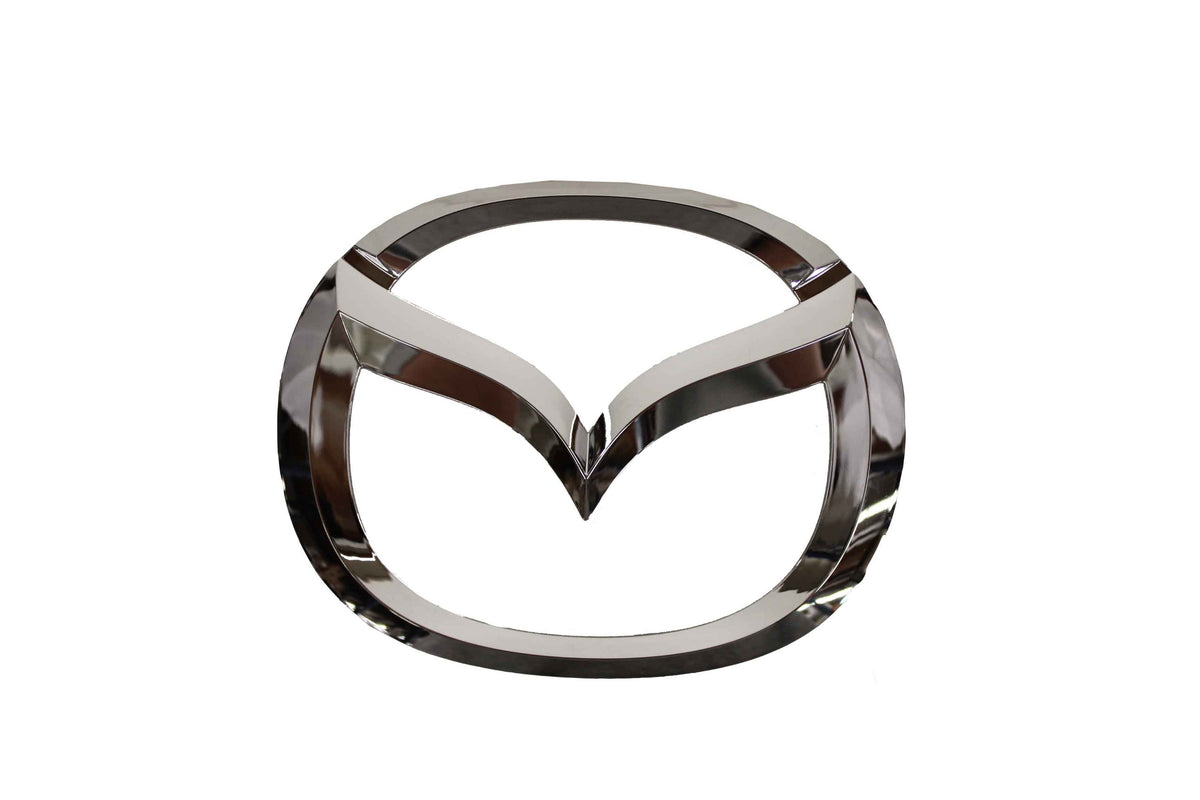Mazda front emblem full view showing precise factory finish and brand restoration