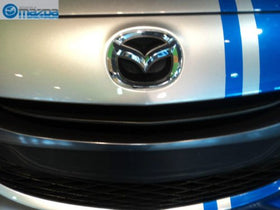 Mazda lifestyle car front badge displayed on vehicle improving overall curb appeal