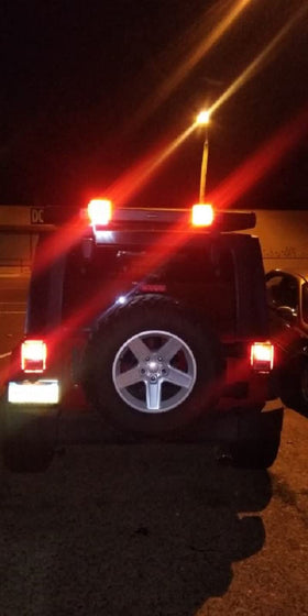 MECMO tow setup showing Jeep with trailer and secure lighting connection