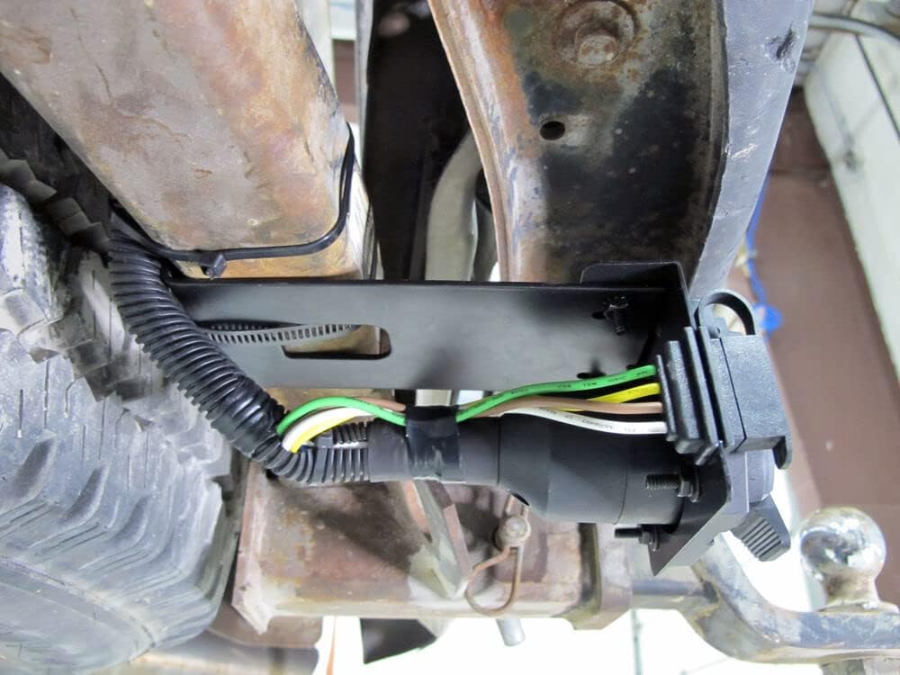 MECMO adapter connected to trailer in outdoor setting enabling quick hookup on the road