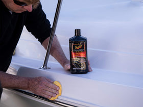 Meguiar's being applied to RV side demonstrating quick one-step restoration