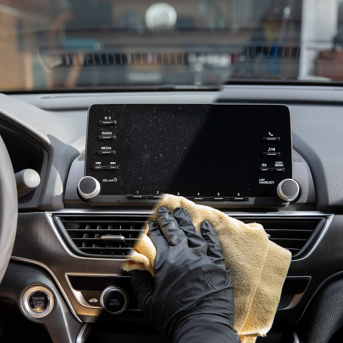 Meguiar's bottle beside microfiber towel indicating refill value and convenience benefit